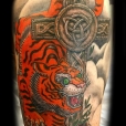 Tiger cross tattoo